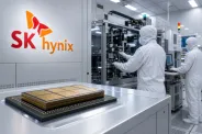 An SK hynix advanced-memory package on a semiconductor manufacturing floor with engineers inspecting equipment.